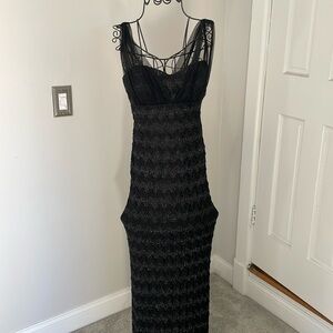 8 black Betsy and Adam floor length dress. Tule over shoulders. Stretchy